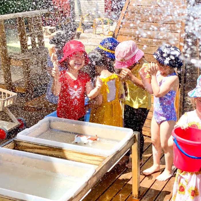 children splashing around wth water